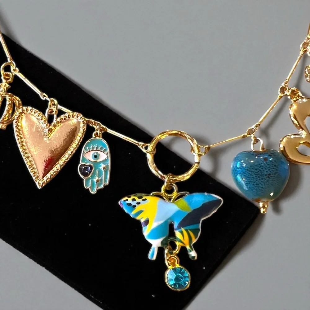 Unique and Gorgeous Gold toned Necklace with Varying Blue and Yellow Charms